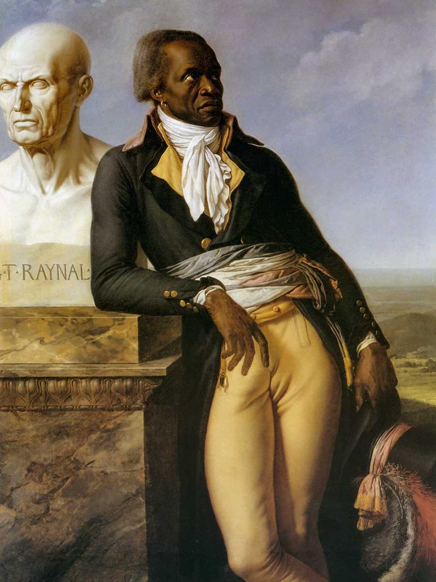 Jean-Baptiste-Belley Ein schwarzer Mann in historischem Gewand stützt sich auf einen Sockel mit einer Büste mit der Aufschrift Raynal in einer Außenanlage.